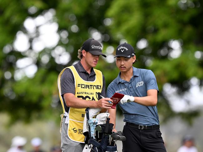 Min Woo Lee talks tactics with his caddie during day three of the 2023 Australian PGA Championship at Royal Queensland Golf Club. Picture: Getty Images