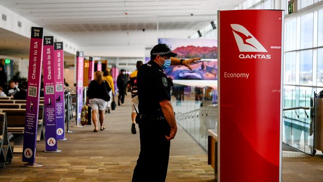 Police monitoring arrivals from Brisbane at Adelaide Airport in Adelaide, Monday, August 2, 2021. Picture: The Advertiser/ Morgan Sette