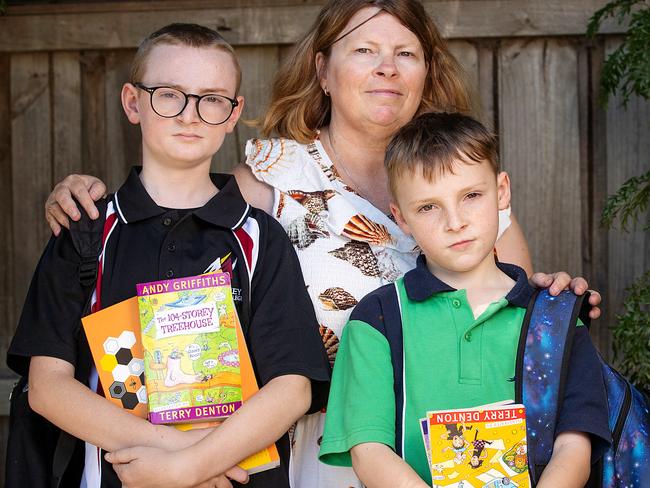 MELBOURNE, JANUARY 16, 2024: Melbourne is AustraliaÃs most expensive city for a public education. Frankston North mother Kylie Davis with Max (glasses), 12, and Jacob (green top), 9. Picture: Mark Stewart