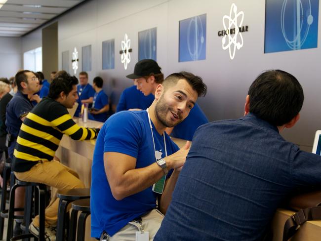 Andres helps a customer on the third floor of Sydney’s Apple store.