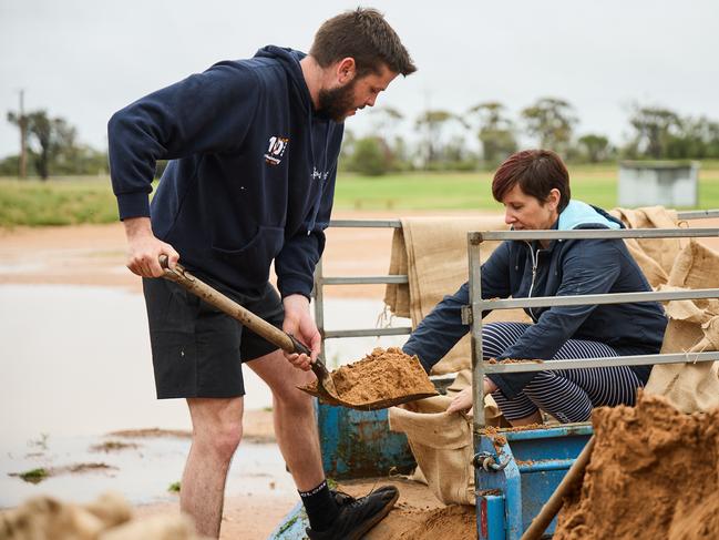 Ben and Jodie Piggott preparing sandbags for potential flooding in Morgan, Sunday, Oct. 23, 2022. Picture: MATT LOXTON