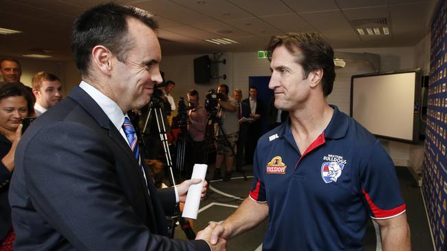 Western Bulldogs CEO Simon Garlick congratulates Luke Beveridge. Picture: David Caird