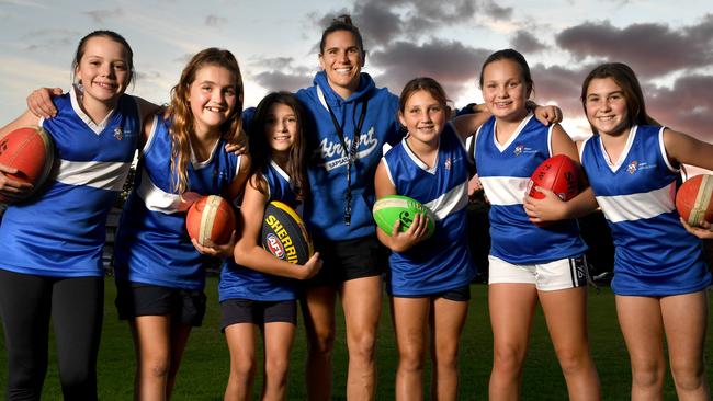 Crows captain Chelsea Randall with Henley Beach Primary students Sophia, Bella, Sarah, Marley, Lulu and Hayden who are part of the Airport district team she will be coaching at the Sapsasa Metro Football Carnival. Picture: Tricia Watkinson