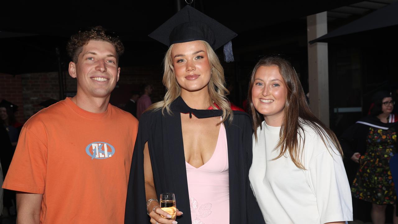 Oliver Scott, Chloe Andrew-Fisher and Olivia Kenna at the Deakin School of Humanities and Social Sciences graduation on Wednesday evening. ALL PICTURES: Alan Barber