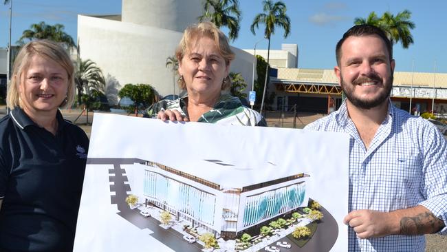 GBRMPA chief operating officer Natalie Conner, Therese Smith and Phillip Thompson hold plans for the office building in 2021.