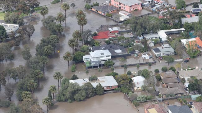 Flood water inundates homes and streets by the Maribyrnong River in the Flemington area of Melbourne. Picture: David Caird