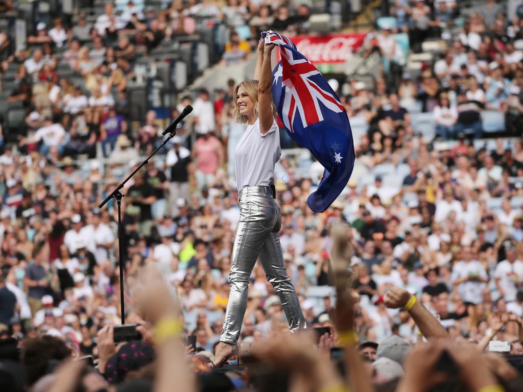 Delta Goodrem draped herself in the Australian flag. Picture: Richard Dobson