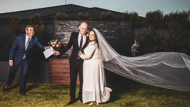 Natasha O’Brien and Leigh Costopoulos with celebrant Mike Larkan. Picture: Nicole Cleary