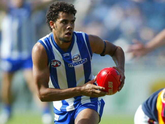 Daniel Wells in action for North Melbourne in 2004.