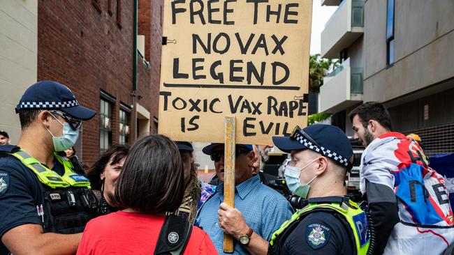 Serbian tennis fans and anti vaccination protesters argue with pro-refugee supporters outside the Park Hotel in Melbourne, Australia. Picture: Diego Fedele/Getty Images