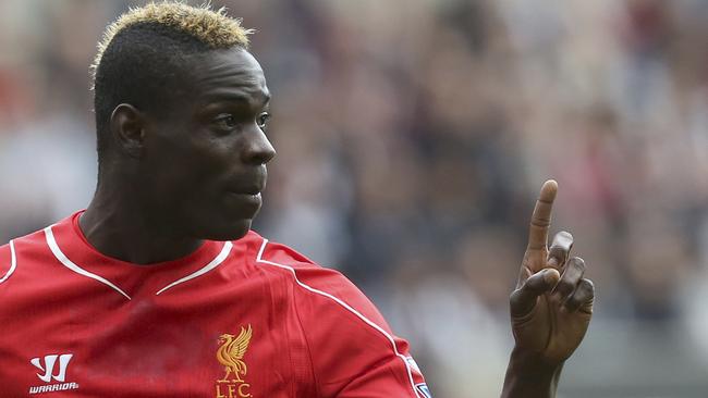 FILE - This is a Saturday, Nov. 1, 2014 file photo of Liverpool's Mario Balotelli as he gestures during the English Premier League soccer match against Newcastle United at St James' Park, Newcastle, England. Balotelli is Tuesday Dec. 2, 2014, facing an investigation from the English Football Association after a post on social media site Instagram was criticized for being racist and anti-Semitic. Balotelli uploaded a picture of the video game character Super Mario, with whom the Italy international shares a nickname, with text around the image including "jumps like a black man and grabs coins like a Jew." (AP Photo/Scott Heppell)