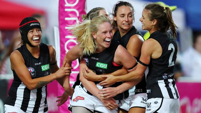Sarah D’Arcy is mobbed by teammates after kicking a goal. Picture: Michael Klein