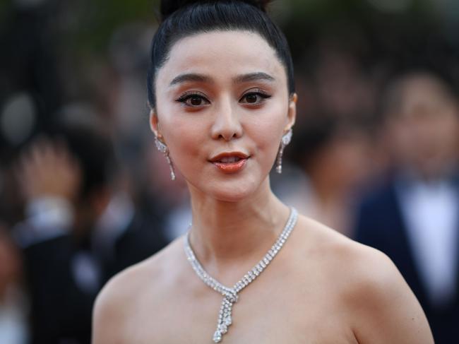 (FILES) This file picture taken on May 8, 2018 shows Chinese actress Fan Bingbing posing as she arrives for the screening of the film "Todos Lo Saben (Everybody Knows)" and the opening ceremony of the 71st edition of the Cannes Film Festival in Cannes, southern France. - China's highest paid movie star Fan Bingbing, who has not been seen in public since July 2018, was placed last in an academic report published September 2018 ranking A-list celebrities on their social responsibility. (Photo by LOIC VENANCE / AFP)