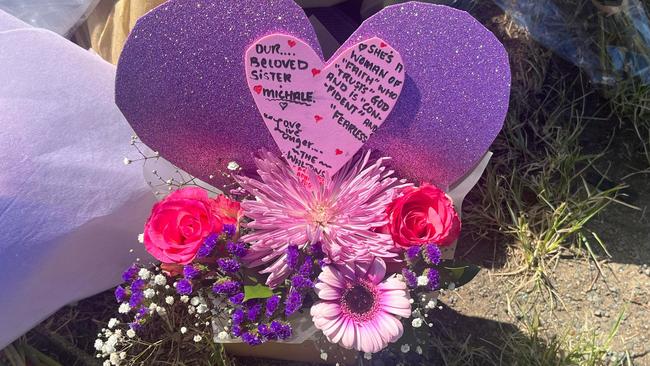 A heartfelt card dedicated to Michale Chandler sits at the crash site.