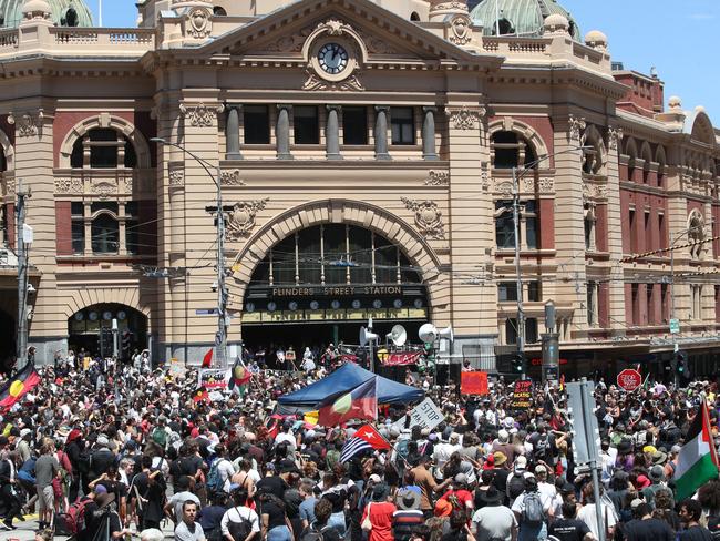 Crowds cheer on speakers at the Invasion Day Rally. Picture: David Crosling