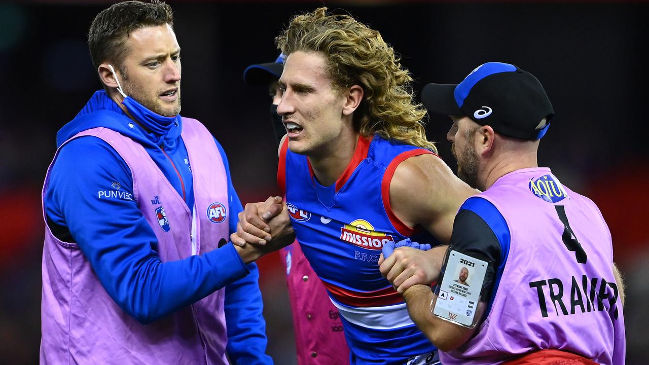 Trainers helped Naughton from the field on Sunday evening. (Photo by Quinn Rooney/Getty Images)