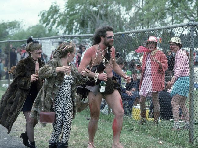 Punters wearing extreme costumes attend the race in 1984.