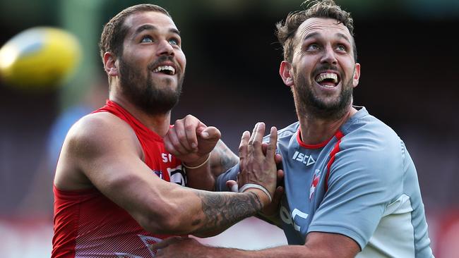 Lance Franklin works with Nick Davis at Sydney training. Picture: Phil Hillyard