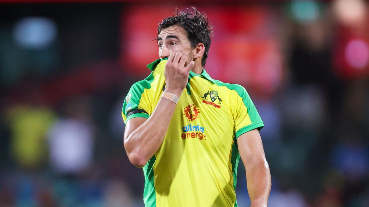 Mitchell Starc reacts after teammate Pat Cummins missed a catch.