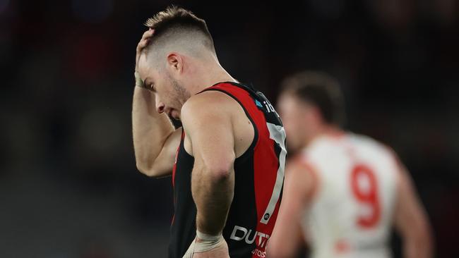 MELBOURNE, AUSTRALIA - AUGUST 16: Zach Merrett of the Bombers reacts on the final siren during the round 23 AFL match between Essendon Bombers and Sydney Swans at Marvel Stadium, on August 16, 2024, in Melbourne, Australia. (Photo by Daniel Pockett/Getty Images)