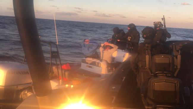 Queensland Police Service SERT officers intercept Dru Baggaley's boat.