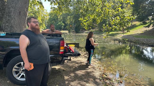 Anthony Hall, left, says conspiratorially there are fewer geese on the creek than last year. Picture: Charlotte McDonald Gibson/The Times