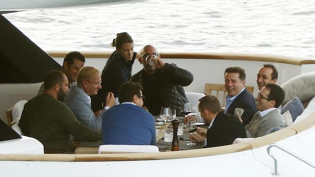 Karl Stefanovic enjoys a laugh with his high-powered mates on the superyacht Mohasuwei. Picture: News Corp