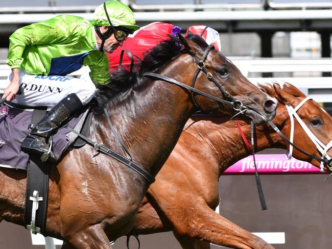 Dwayne Dunn and Royal Symphony fly late to win at Flemington. Picture: Getty Images