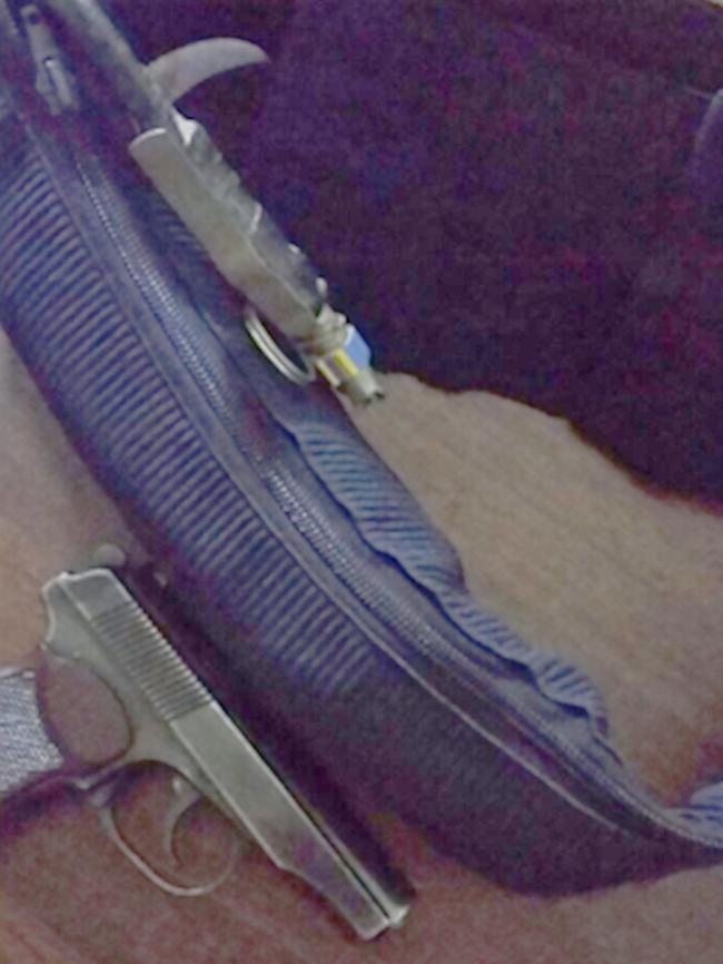 A pistol sits with a suicide belt in this picture from the Telegram account of Shadi Jabar.