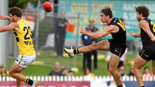 Luke Partington gets his kick away for Glenelg in the Tigers’ triumph over Woodville-West Torrens. Picture: Tom Huntley