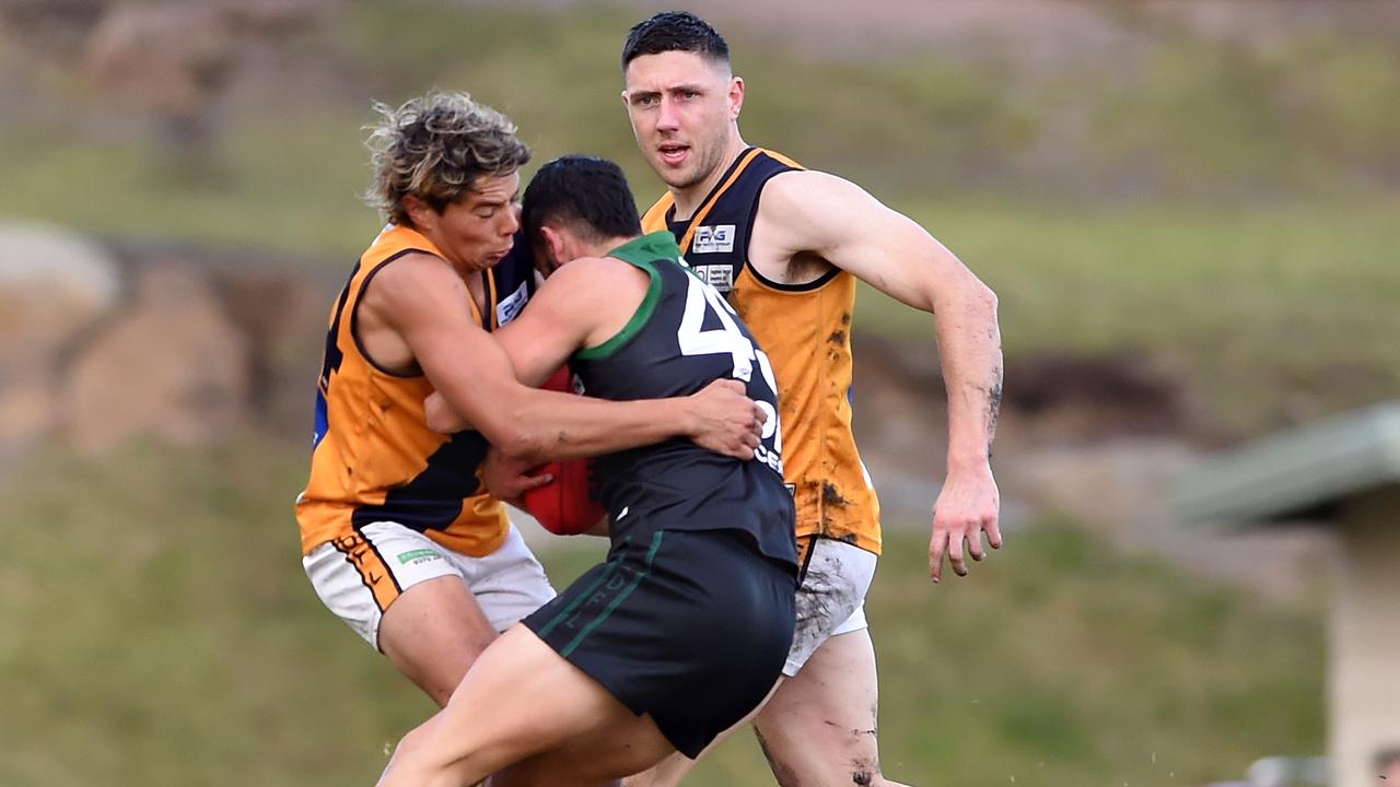 Essendon District: Strathmore’&#149;s Ben Reddick wraps up Patrick Baccari of Greenvale. Picture: Steve Tanner