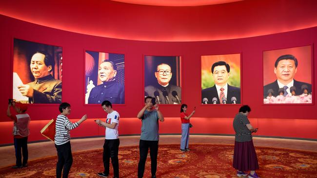 On par: Xi Jinping’s portrait appears alongside those of Mao Zedong and former Chinese leaders Deng Xiaoping, Jiang Zemin and Hu Jintao at an exhibition in Beijing in 2019 on the eve of the 70th anniversary of the founding of the People's Republic of China. Picture: AFP