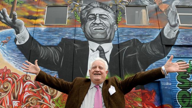 Franco Cozzo with art work on the side of his building in Footscray. Picture: David Smith