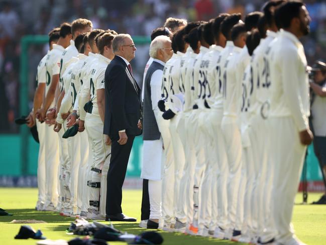 Mr Albanese lines up with the Australian team for the national anthem. Picture: Getty