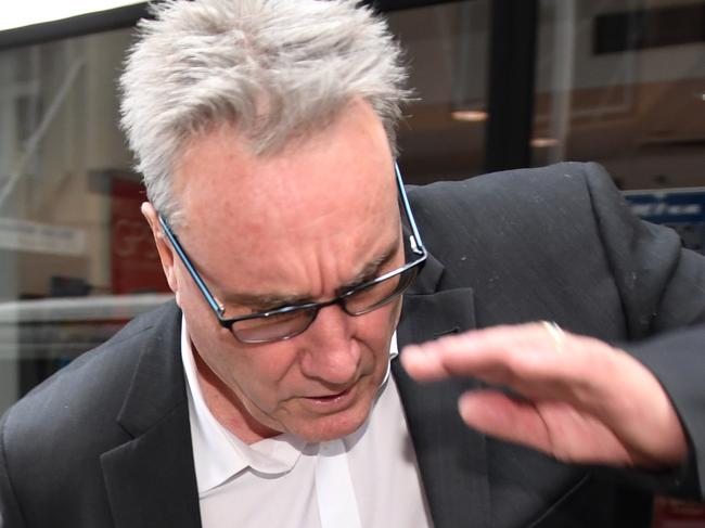 ATO deputy commissioner Michael Cranston, the father of Adam Cranston, is seen near the Central Local Court in Sydney on Thursday, May 18, 2017. Adam Cranston is one of nine people have been arrested over a $165 million tax fraud investigation. (AAP Image/Paul Miller) NO ARCHIVING