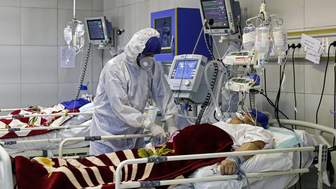 A medic treats a patient infected with coronavirus at a hospital in Tehran, Iran. Picture: Ali Shirband/Mizan News Agency via AP