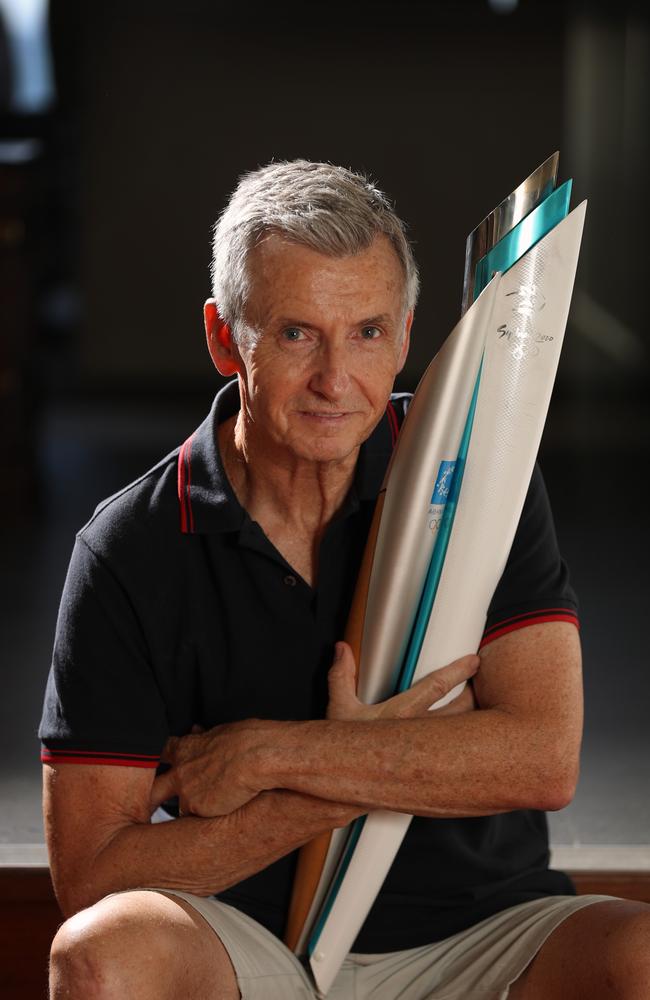 Bruce McAvaney with a Sydney Olympic torch at home in Adelaide. Picture: Alex Coppel