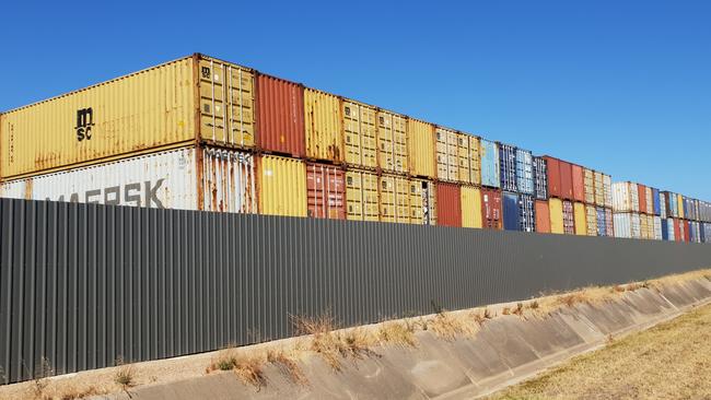 Some of the shipping containers containing the unprocessed recycling at Wingfield. Picture: Colin James