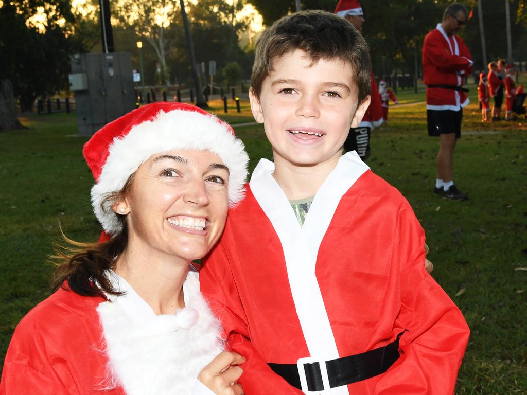 Anna McDonald and Nicholas, 7, at the Christmas in July Santa Fun Run at Mindil Beach. Picture Katrina Bridgeford