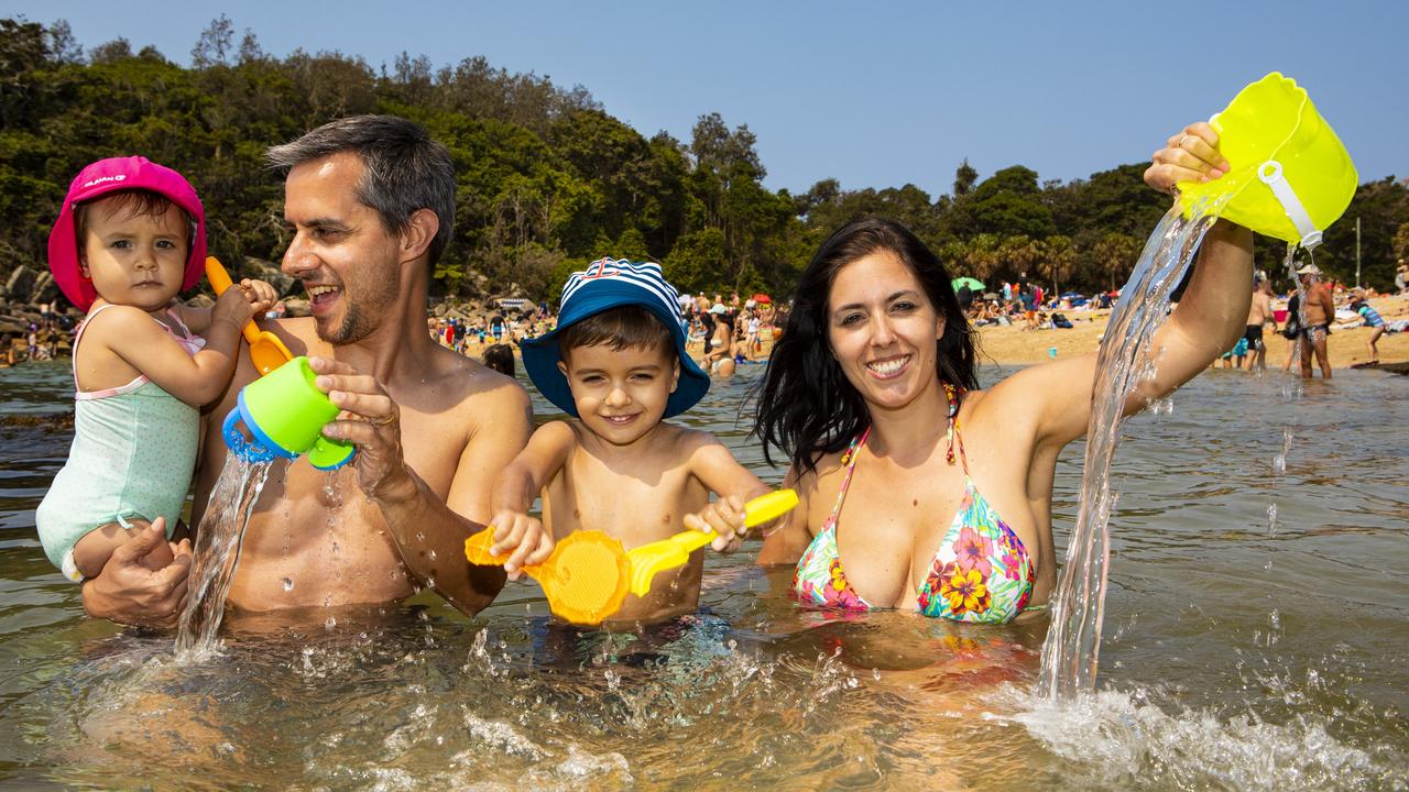 Tiago Fernandes and Marlene Nogueire with their children Eva and Diogo at Shelly Beach, NSW, trying to stay cool during a heatwave this summer.