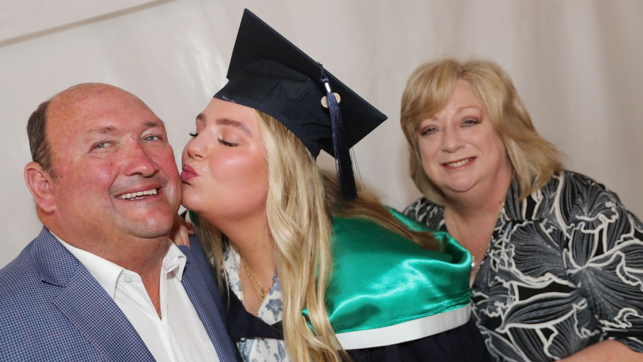 Graduate Emma Hunt with Michael and Michelle Hunt. Picture: Mark Wilson