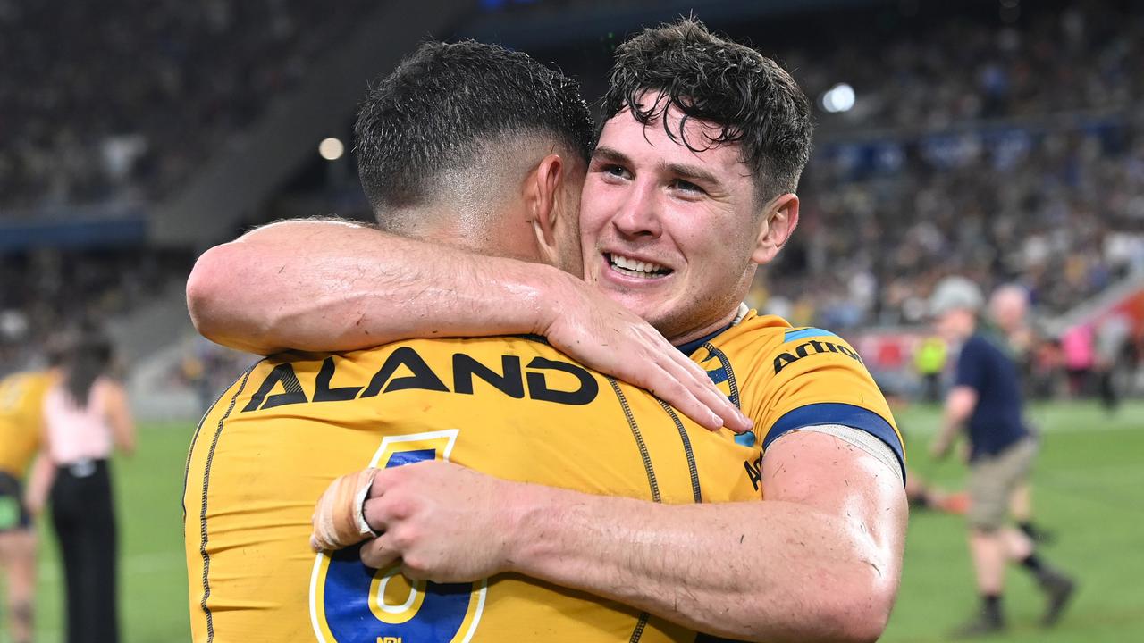 Mitch Moses hugs Dylan Brown after the Eels booked their ticket to the grand final. Picture: Bradley Kanaris/Getty Images