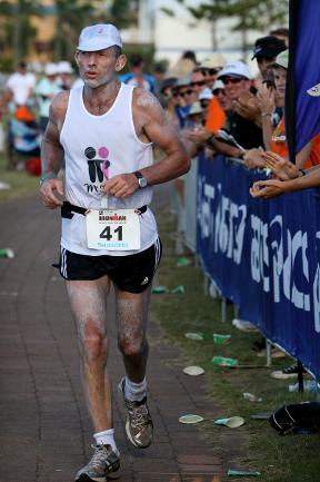 <p>Tony Abbott completes the run leg of an Ironman race in Port Macquarie. Picture: Nathan Edwards</p>