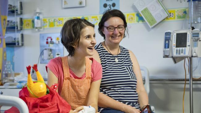 Eva Palmer and her mum Samantha Palmer share a laugh with the clowns.