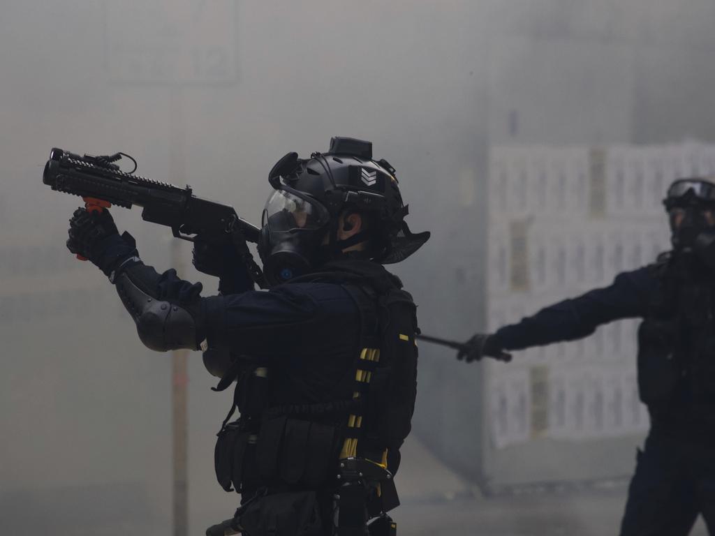 Police use tear gas on protesters calling for electoral reforms and a boycott of the Chinese Communist Party in Hong Kong. Picture: AP Photo/Ng Han Guan