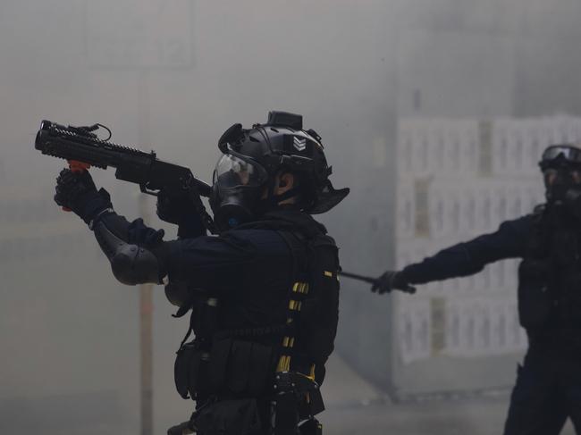 Police use tear gas on protesters calling for electoral reforms and a boycott of the Chinese Communist Party in Hong Kong. Picture: AP Photo/Ng Han Guan