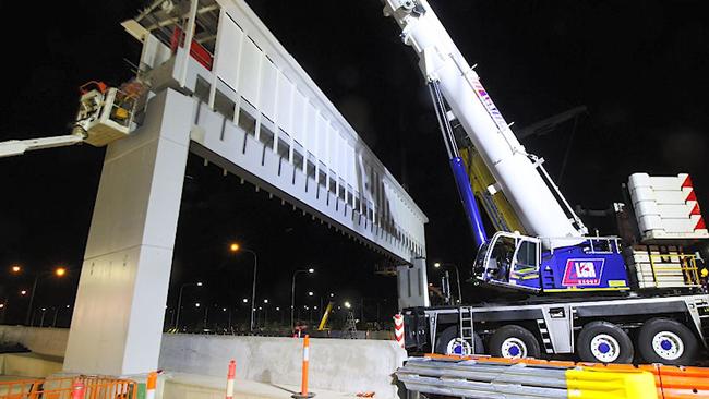 The bridge being built at night.