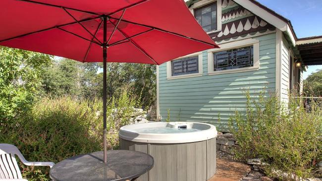 The house might be tiny but there’s still room for a hot tub. Picture: HomeAway.