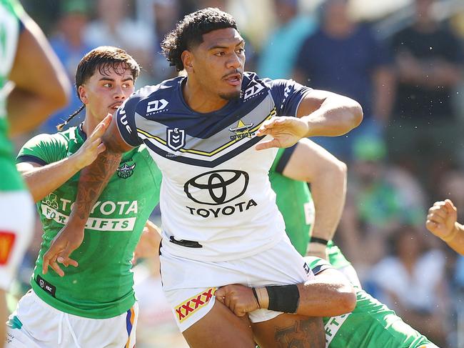 Thomas Mikaele of the Cowboys offloads during the NRL Pre-season challenge match between Canberra Raiders and North Queensland Cowboys. (Photo by Mark Nolan/Getty Images)