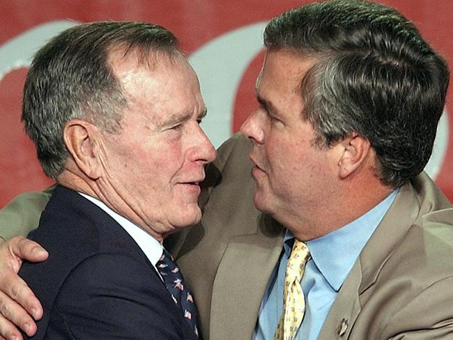 Fatherly love: Jeb Bush is congratulated by his dad after being re-elected in Miami in 2002.